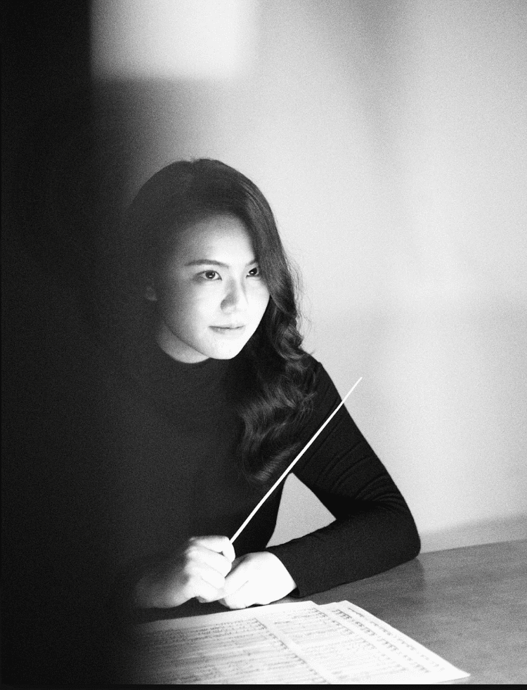 Charlotte Wang at the podium during a performance of her music